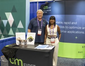 Two exhibitors posing for a photo
