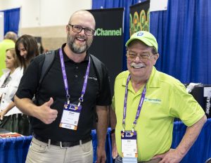Two people posing in the Exhibit Hall